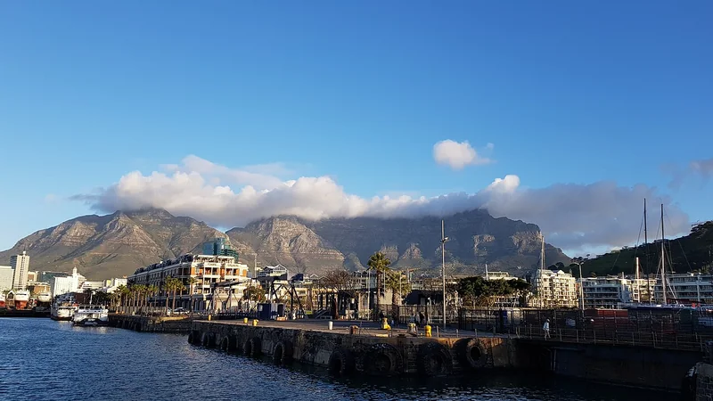 Table Mountain above the boats and quays of Cape Town's V&A Waterfront