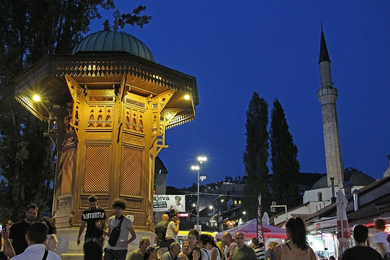 Sebilj fountain illuminated at night in Sarajevo’s Baščaršija